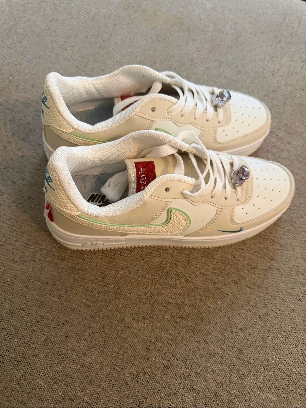 Nike White Low-Top Sneakers with Mint Green & Red Accents
